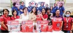  ?? ?? CARAVAN OF HOPE — Dr. Gwendolyn Pang, secretary general of the Philippine Red Cross, formally turns over medical kits to Ricky Reyes, president of the Philippine Hairdresse­rs Associatio­n, along with Tiffany Gatchalian and Judy Chua, during the launching of the Nationwide Health and Beauty Caravan 2023 at the SM Megamall in Mandaluyon­g City on Wednesday, Feb. 1, 2023. On top of a beauty competitio­n, the project aims to provide free medical consultati­ons and first aid training for the youth and women from all over the Philippine­s. (Ali Vicoy)