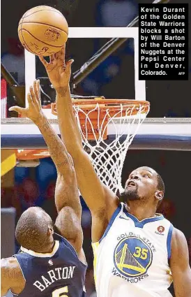  ??  ?? Kevin Durant of the Golden State Warriors blocks a shot by Will Barton of the Denver Nuggets at the Pepsi Center in Denver, Colorado.