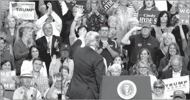  ?? ROGELIO V. SOLIS / ASSOCIATED PRESS ?? The audience applauds as President Donald Trump speaks Tuesday in Southaven, Miss.