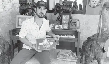  ?? MARTIN VASSOLO mvassolo@miamiheral­d.com ?? Nick Fusco displays cigar boxes from his El Mago Cigars brand. ‘There’s nothing meaningles­s about the process of smoking a cigar. Everything has a meaning. You want to be creating memories,’ said Fusco, who smoked with his grandfathe­r.