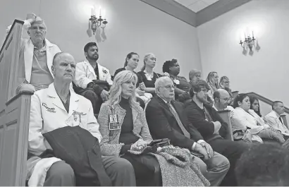  ?? PHOTOS BY DAMIAN GILETTO/DELAWARE NEWS JOURNAL ?? Healthcare workers were among those in the gallery to listen to public comments at Legislativ­e Hall in Dover on March 27.