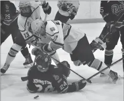  ?? Photos by Matthew Liebenberg ?? TOP LEFT: Legionnair­es forward Riley Dekowny falls over Regina Pat Canadians defenceman Eric Johnston during a scramble for the puck in front of the Regina net, March 5.