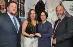  ??  ?? TY Student of the Year Arina Risovaite receives her prize from TY Coordinato­r Audrey Flood watched by Principal Pádraig McGovern and Mark McCormack, guest speaker at the Ó Fiaich College TY Graduation.