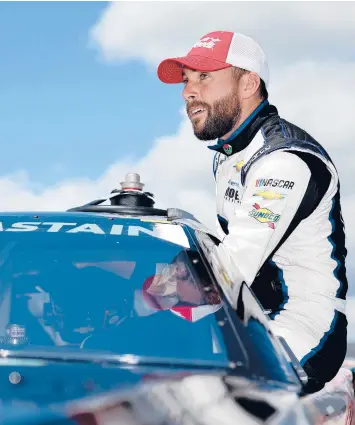  ?? JAMES GILBERT/GETTY ?? Ross Chastain enters his car during qualifying Saturday for the Goodyear 400 in South Carolina.