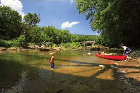  ??  ?? BELOW: Anglers see what’s biting in the Cacapon River.