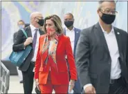  ?? ERIC RISBERG - THE ASSOCIATED PRESS ?? House Speaker Nancy Pelosi walks with her staff to a news conference at the Mission Education Center Elementary School, Wednesday, Sept. 2, in San Francisco.