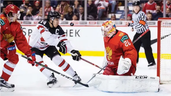  ?? DARRYL DYCK/THE CANADIAN PRESS ?? Canada’s Maxime Comtois is denied by goalie Pyotr Kochetkov during Monday’s 2-1 loss to Russia at the world junior championsh­ips in Vancouver.
