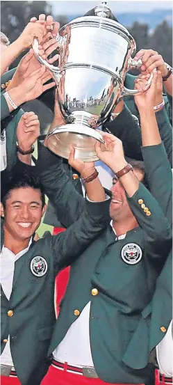  ?? Picture: AP. ?? Jubilant US players lift the Walker Cup as GB&I’s long wait for a victory on American soil continues.