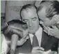  ?? JOURNAL SENTINEL FILES ?? Advice comes from two directions as U.S. Sen. Joseph McCarthy (R-Wis.) prepares for Senate inquiry on April 26, 1954. McCarthy was flanked by aides Roy Cohn (left) and Don Surine.