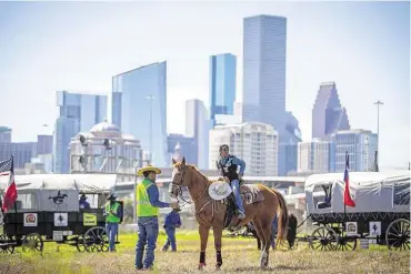  ?? Mark Mulligan / Staff photograph­er ?? Jada Pierre, 9, and the Northeaste­rn Trail Ride get back in the saddle near the end of their Beaumont-to-Houston trek.