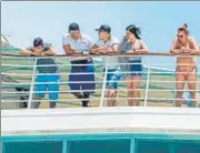  ?? AFP ?? ■
Tourists stranded over coronaviru­s fears peak from inside the Monarch cruise at the port of Colon in Panama City.