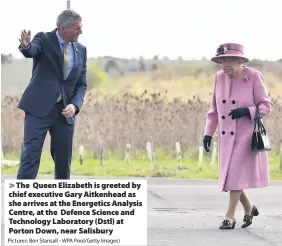  ?? Pictures: Ben Stansall - WPA Pool/Getty Images) ?? The Queen Elizabeth is greeted by chief executive Gary Aitkenhead as she arrives at the Energetics Analysis Centre, at the Defence Science and Technology Laboratory (Dstl) at Porton Down, near Salisbury