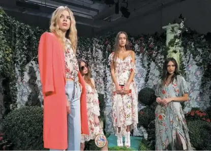  ?? Sara Bauknecht/Post-Gazette ?? Feminine floral frocks and colorful outerwear by Alice + Olivia for spring.