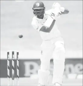  ??  ?? Roston Chase drives during his top score of 64 an innings which included seven fours and came off 88 balls.
