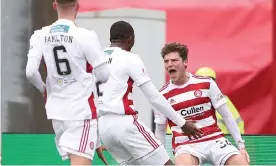  ??  ?? Ross Callachan celebrates his dramatic late equaliser for Hamilton against leaders Rangers. Photograph: Ian MacNicol/Getty Images