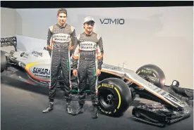  ??  ?? Force India drivers Sergio Perez, right, and Esteban Ocon.