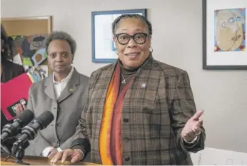  ?? ASHLEE REZIN/SUN-TIMES ?? Mayor Lori Lightfoot listens Thursday at the Brainerd Park Apartments as U.S. HUD Secretary Marcia Fudge says of a federal homeless grant, “We know that it is going to make a difference.”