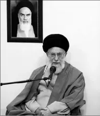  ?? OFFICE OF THE IRANIAN SUPREME LEADER VIA AP ?? Ayatollah Ali Khamenei delivers a speech on Tuesday while sitting under a portrait of the late Iranian revolution­ary founder Ayatollah Khomeini in Teheran.