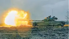  ?? ?? Ukrainian soldiers in a captured Russian T-80 tank fire at a Russian position in the Donetsk region.