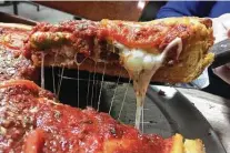  ?? Chuck Blount / Staff file photo ?? No. 9 Chicago’s Pizza serves the kind of slices you’d expect to find in its namesake city.