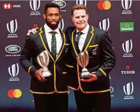  ?? EPA PIC ?? South Africa captain Siya Kolisi (left) and head coach Rassie Erasmus after winning the Team of the Year and Coach of the Year at the World Rugby Awards in Tokyo on Sunday.