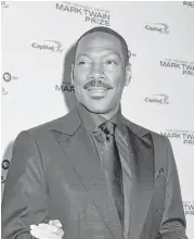  ?? Kris Connor / Getty Images ?? Eddie Murphy arrives Sunday at the Kennedy Center, where he was honored with the Mark Twain Prize.