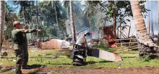  ?? (Armed Forces of the Philippine­s/Reuters) ?? THE SITE of a Philippine­s Air Force Lockheed C-130 plane that crashed carrying troops on Sunday in the Sulu province.
