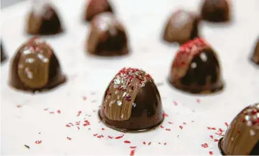  ?? Grace Ramey / Associated Press ?? The cost of Valentine’s Day gifts, including these truffles, is about the same as last year, according to the “Cost of Loving Index.” The combined price of nine popular gifts in 2019 rose half a percent to $1,234.11.