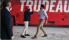  ??  ?? The Canadian Press
Liberal Leader Justin Trudeau greets MP candidates as he makes a campaign stop in an airplane hanger during the Canadian federal election campaign in Mississaug­a, Ont., on Friday.