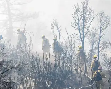  ?? Irfan Khan Los Angeles Times ?? ABOUT 300 firefighte­rs and 13 air tankers were battling the blaze near the Mt. Wilson Observator­y.