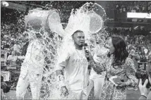  ?? Gregory Bull Associated Press ?? LUIS ARRÁEZ is doused by fellow Padres Manny Machado, left, and Fernando Tatis Jr. after his walk-off single in the ninth.