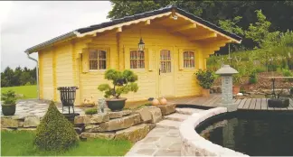  ?? EZ LOG STRUCTURES ?? Looking for an economical way to build a summer cottage? This milled log home comes as a kit and the cost runs $60 to $80 per square foot.