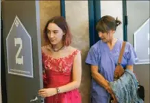  ?? MERIE WALLACE, THE ASSOCIATED PRESS ?? Saoirse Ronan, left, and Laurie Metcalf in a scene from "Lady Bird," which is favoured to win for best comedy or musical.