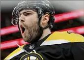  ?? Maddie Meyer / Getty Images ?? Jake DeBrusk of the Bruins celebrates after scoring a goal against the Islanders during the first period at TD Garden in Boston on Saturday.