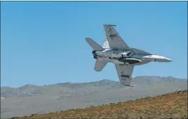  ?? KGrif Photograph­y ?? THE AIR FORCE and Navy have used Death Valley for training since the 1930s. The low-level f lights have been a popular tourist attraction at the national park.