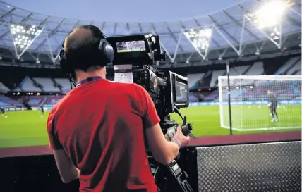  ?? Michael Regan ?? A cameraman films the warm up before a Premier League match at London Stadium
