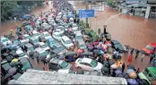  ??  ?? Vehicles stranded in Thane during the flood on August 29.