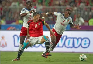  ?? AFP ?? Egypt’s Ramadan Sobhi vies for the ball against Congo’s Fernand Mayembo during their World Cup 2018 Africa qualifying match in Alexandria. —