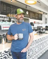  ?? JIM WELLS ?? Andy Fennell, who runs Gravity Espresso and Wine Bar, will reopen his business in the Calgary Board of Education building Monday.