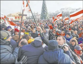  ?? Sergei Grits The Associated Press ?? Protesters argue with government supporters Saturday at a rally in Minsk, Belarus.