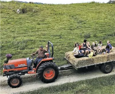  ?? BY CHERL CREWS ?? Bryant Lee took the CCLC teachers, and parents, on a hay wagon ride to tour the farm, pick apples, see the cows and the baby calf that was just born.