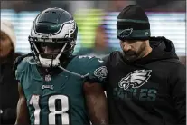  ?? ADAM HUNGER — THE ASSOCIATED PRESS ?? Eagles head coach Nick Sirianni and wide receiver Jalen Reagor walk off the field after Sunday’s 13-7loss to the New York Giants.