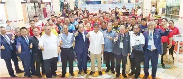  ??  ?? WE CAN DO IT: Masiung (front, fifth right) together with Philip (sixth right), Abu Hanapiah (second right) and others at the opening ceremony of the National Weightlift­ing Open Championsh­ips held at Star City Mall in Asia City, Kota Kinabalu yesterday.