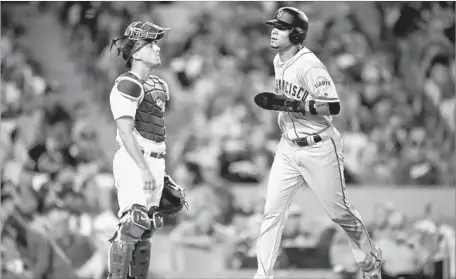  ?? Mark J. Terrill Associated PRess ?? DODGERS CATCHER Austin Barnes can only watch as San Francisco’s Gorkys Hernandez scores on a fifth-inning single Saturday.