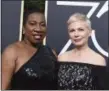  ?? JORDAN STRAUSS — THE ASSOCIATED PRESS ?? Tarana Burke, left, and Michelle Williams arrive at the 75th annual Golden Globe Awards at the Beverly Hilton Hotel on Sunday in Beverly Hills.