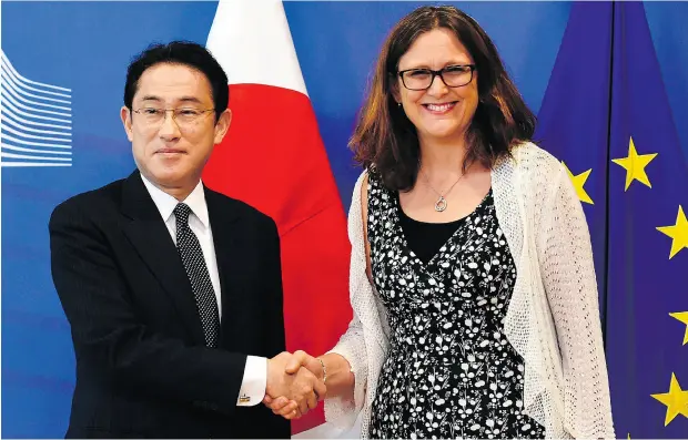  ?? JOHN THYS / AFP / GETTY IMAGES ?? Japan Foreign Minister Fumio Kishida is welcomed by EU Trade Commission­er Cecilia Malmstrom at the EU headquarte­rs in Brussels on Wednesday. Negotiator­s for the EU and Japan have reached “political agreement” on a trade deal, Malmstrom said.