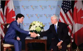  ?? Canadian Press photo ?? Prime Minister Justin Trudeau, left, meets with United States Vice President Mike Pence at the Summit of the Americas in Lima, Peru on Saturday.