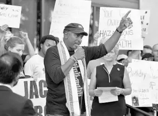  ?? BOB SELF/ASSOCIATED PRESS ?? Ron Davis, father of Jordan Davis — a teen who was killed by a gunman in 2012 — speaks at a rally against gun violence Monday in Jacksonvil­le. Many groups called for changes to combat gun violence in the city.