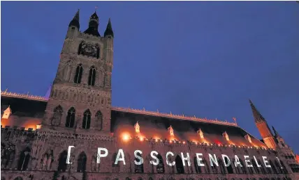  ?? Andrew Matthews ?? > A projection on the side of the Cloth Hall in the Market Square in Ypres, Belgium, during a dress rehearsal ahead of the commemorat­ions to mark 100 years since the start of the Battle of Passchenda­ele