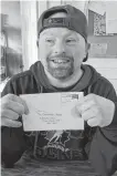  ?? CONTRIBUTE­D ?? David Gunn with a letter received from staff of East Coast Credit Union who have been sending cards and letters to L’arche Cape Breton core members to lift their spirits during the pandemic.